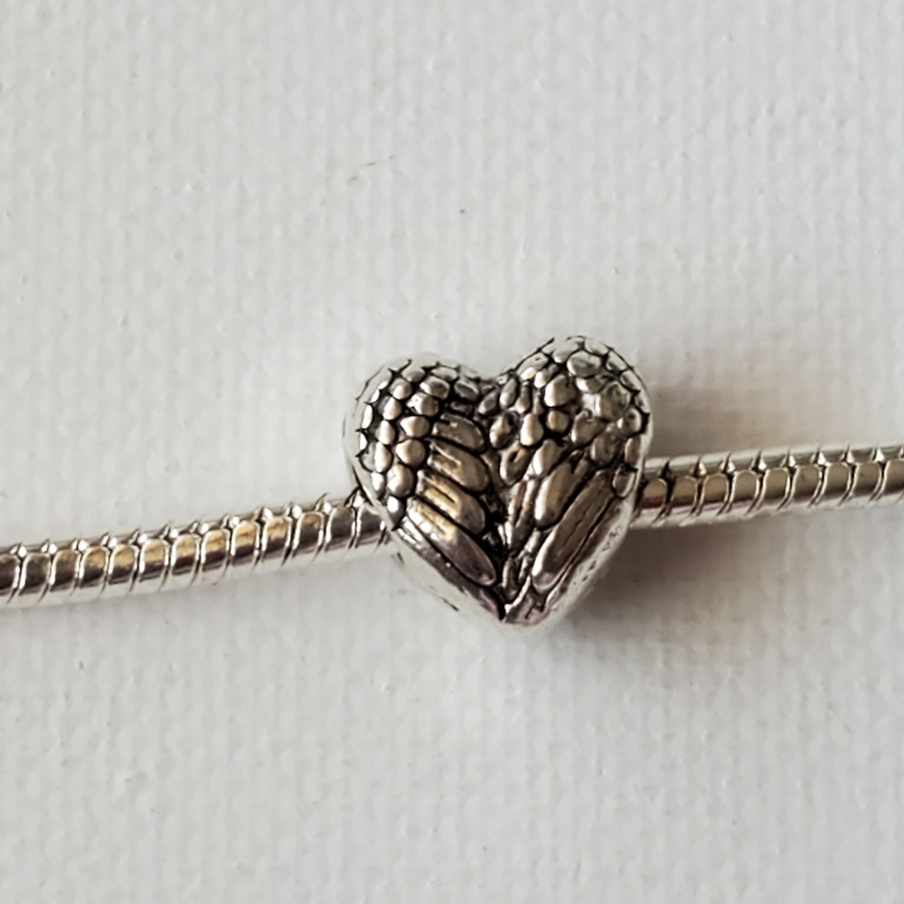 charm. Angels wings.  NWOT.  Fits in Pandora Bracelet.